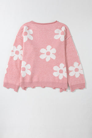 Blush pink knit sweater with white floral pattern and pearl embellishments.