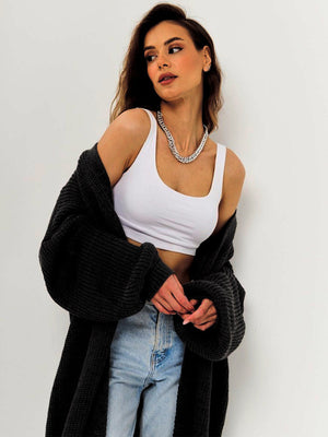 Black oversized ribbed knit maxi cardigan with balloon sleeves.