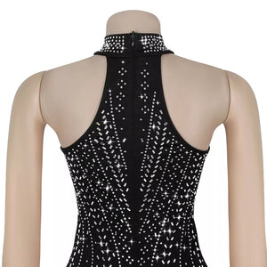 Black halter neck romper with rhinestone embellishments and a high neckline.