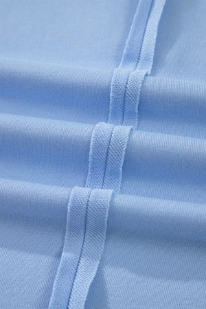 Light blue sleeveless polo set with textured trim detail