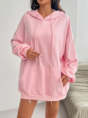 Oversized blush pink hoodie with drawstring detail and front pocket.