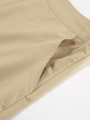 High-waisted A-line skirt in tan cotton with a visible pocket detail.