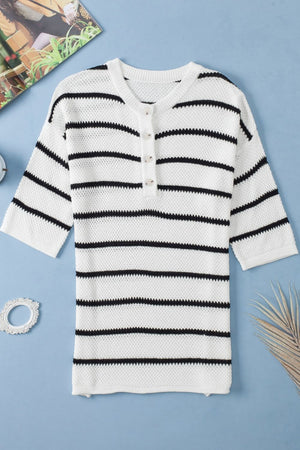 White and black stripe knit pullover sweater with button-down neckline and 3/4 sleeves.