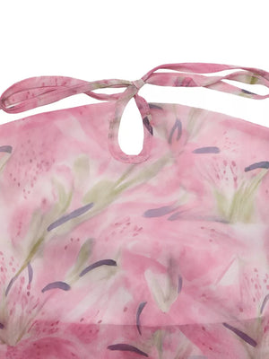Vibrant floral halter cami with tie neck and keyhole detail.