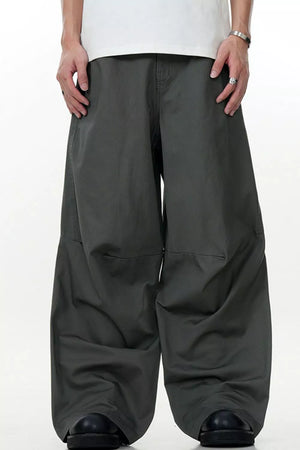 Men's wide leg cargo pants in dark gray, featuring a relaxed fit and casual styling.