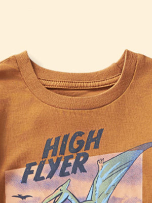 Burnt orange cotton crew neck t-shirt with a blue "High Flyer" graphic and a dinosaur.