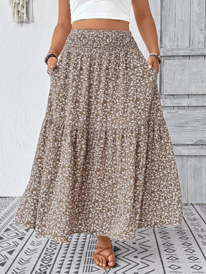 Maxi skirt in mocha with a white floral print, tiered design, and pockets.