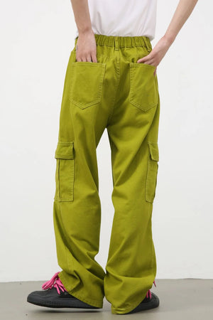 Yellow-green wide leg cargo pants in 100% cotton with multiple pockets.