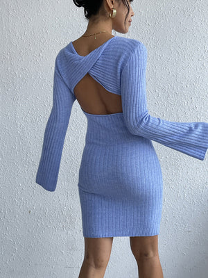Blue ribbed knit dress with long bell sleeves and a twist back cutout.