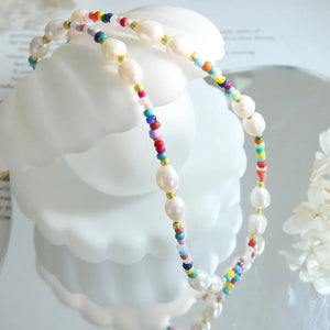 Rainbow bead and baroque pearl choker necklace with gold accents