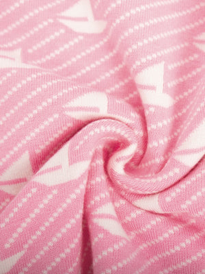 Blush pink knit sweater with white sailboat jacquard pattern and textured stripes.