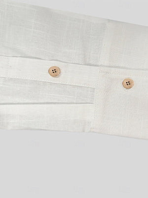 Men's white button-up shirt with wooden buttons and a textured fabric detail.