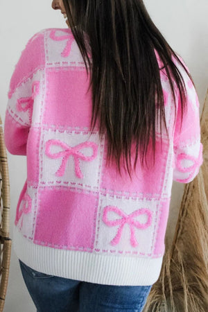 Fuchsia pink and white checkered bow jacquard knit sweater with textured bows.