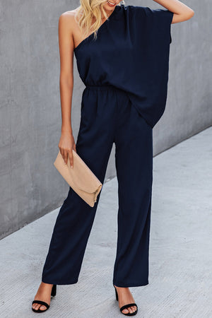 Dark blue asymmetric drape-sleeve wide-leg jumpsuit with elastic waist