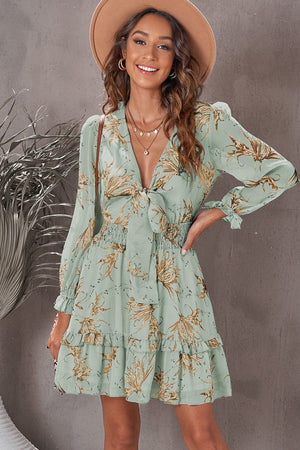 Gum Leaf floral print tie-front mini dress with smocked waist and ruffled hem.