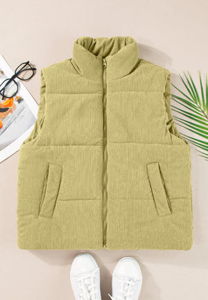 Corduroy padded vest in sage with a stand-up collar and zip front.