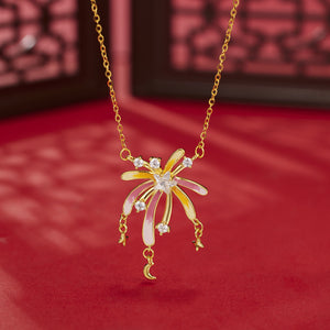 18k gold Starburst pendant necklace with pink & yellow enamel, cubic zirconia accents, and dangling stars & moon charms.