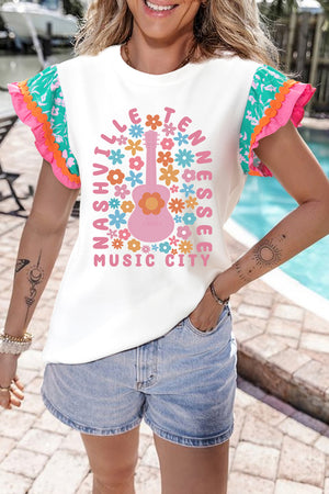 White graphic tee with ruffle sleeves, featuring a pink guitar and floral "Nashville Tennessee Music City" print.