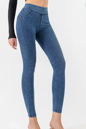 Sculpted denim-effect leggings in medium blue with faux pockets and a high waist.
