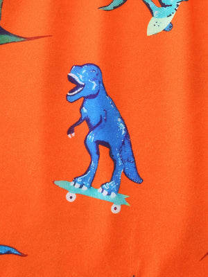 Orange toddler tee with blue skateboarding dinosaur print