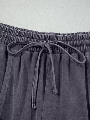 Maternity cropped wide-leg cotton pants in charcoal grey with drawstring waist and elastic waistband.
