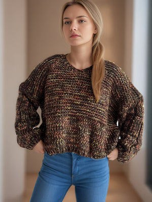 Textured knit sweater with balloon sleeves in a multi-color brown, yellow, and orange marled pattern.