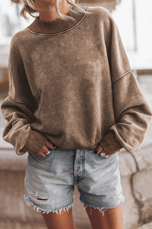Acid wash mock neck sweatshirt in taupe with ribbed cuffs and neckline.