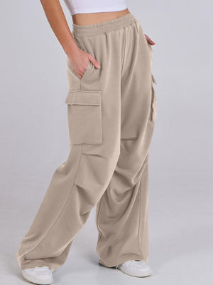 Tan sweatpants with cargo pockets and a wide leg cut.