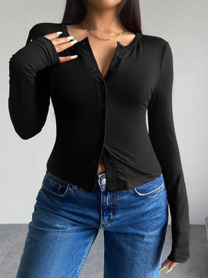 Black button-up cardigan with a deep V-neck and long sleeves, styled with jeans.