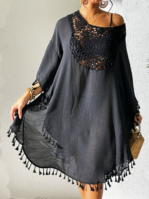 Black crochet yoke tassel kaftan dress with wide sleeves and a flowing hem.
