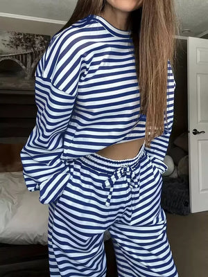 Royal blue and white striped pajama set with drawstring pants and long sleeves.