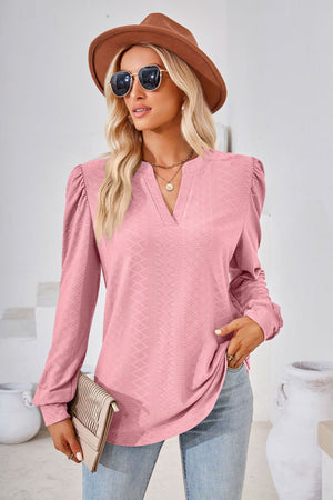 Pink textured blouse with bishop sleeves and v-neck