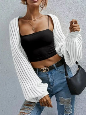 White balloon sleeve cropped knit cardigan with ribbed texture and wide cuffs.