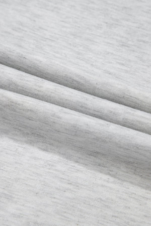 Gray waffle knit henley top with a textured fabric detail.
