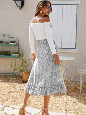 Asymmetric wrap skirt in Gray with a leaf print and ruffled hem.