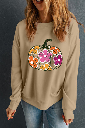 Khaki crewneck sweatshirt with a colorful floral pumpkin graphic, casual autumn style.