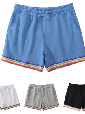 Blue lounge shorts with rainbow trim and elastic waistband