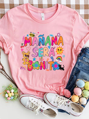 Pink graphic tee with "Mañana Sera Bonito" text and cartoon graphics.