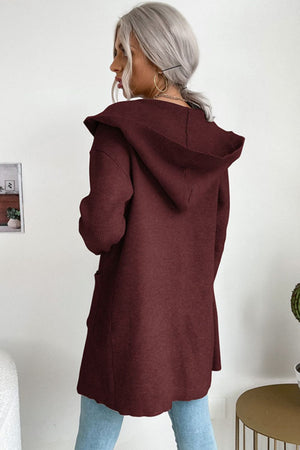 Burgundy ribbed knit hooded cardigan with drape front and pockets.