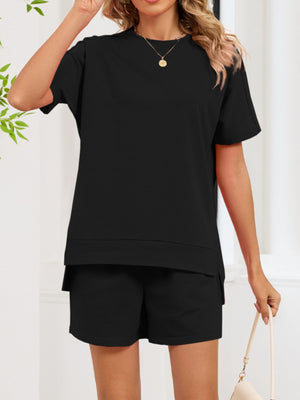 Black relaxed two-piece set with short sleeves, crew neck, and shorts with pockets.