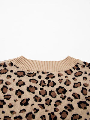 Beige leopard print knit sweater with crew neck and ribbed collar.