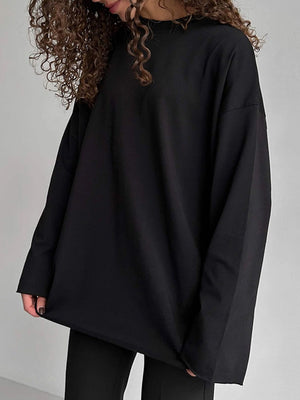 Black oversized cotton jersey top with long sleeves and a relaxed fit.