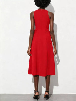 Red A-line midi dress with high neckline, sleeveless, defined waist, and subtle side tie details.