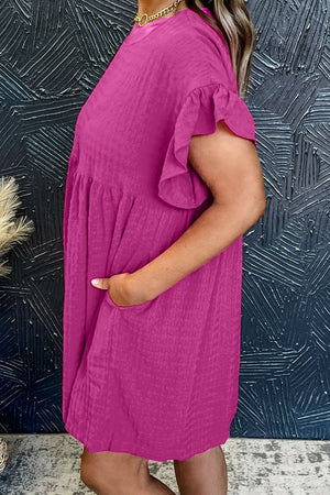 Hot pink textured babydoll dress with ruffle sleeves and pockets.