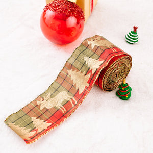 Festive holiday ribbon with plaid pattern, reindeer and tree motifs, and gold trim.