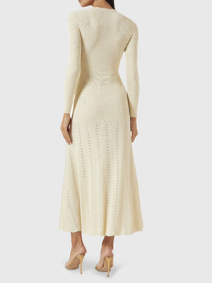 Button-detailed ribbed knit maxi dress in pastel yellow with decorative buttons and a flared skirt.