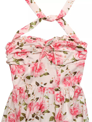 Romantic floral halter midi dress with pink roses and a tie front detail.