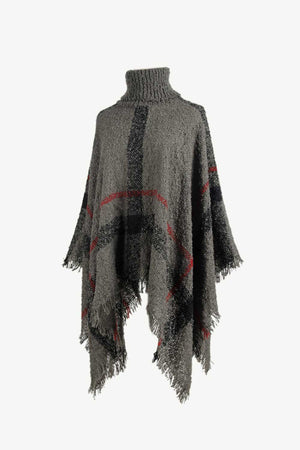 Textured plaid turtleneck cape in charcoal acrylic with fringed hem and red accents.