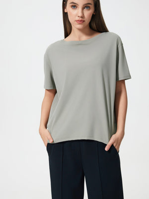 Relaxed fit performance tee in Dusty Blue with a boat neck and short sleeves.