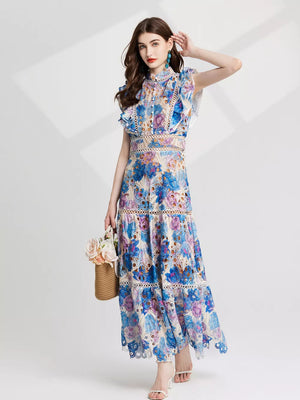Blue purple floral lace maxi gown with cutout details and ruffled sleeves.